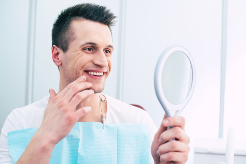 Man smilling in mirror