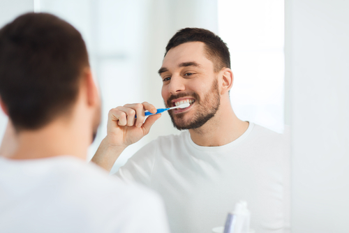 Man brushing teeth